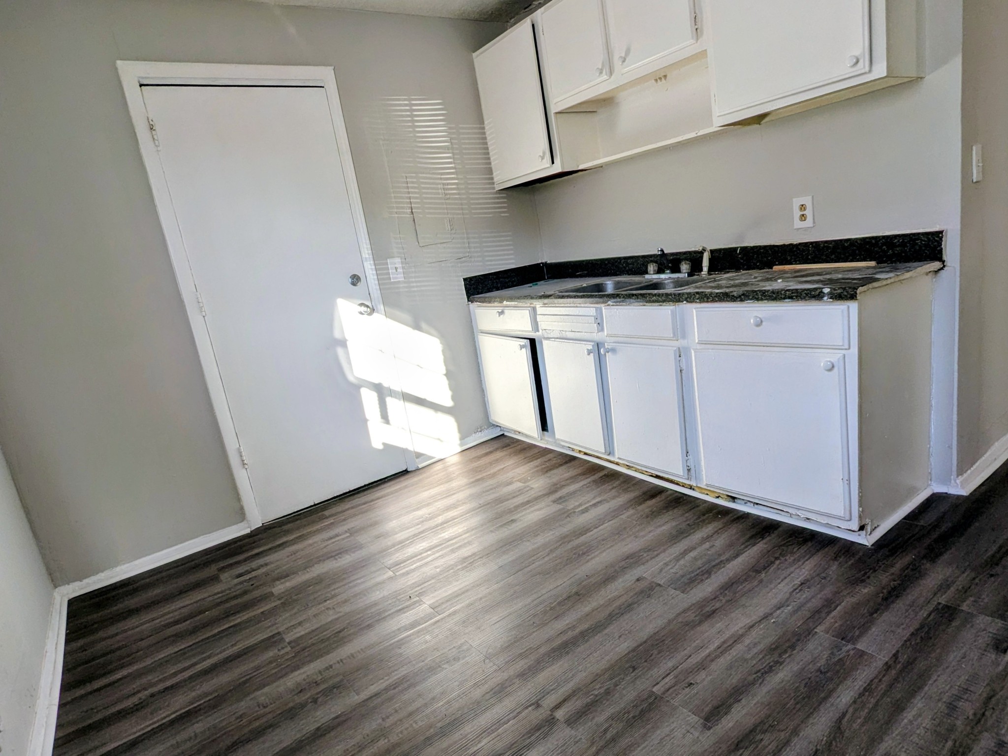118 Rains Avenue, Unit 1 Nashville, TN 37203 - Photo 5 of 7 a view of a kitchen with wooden floor