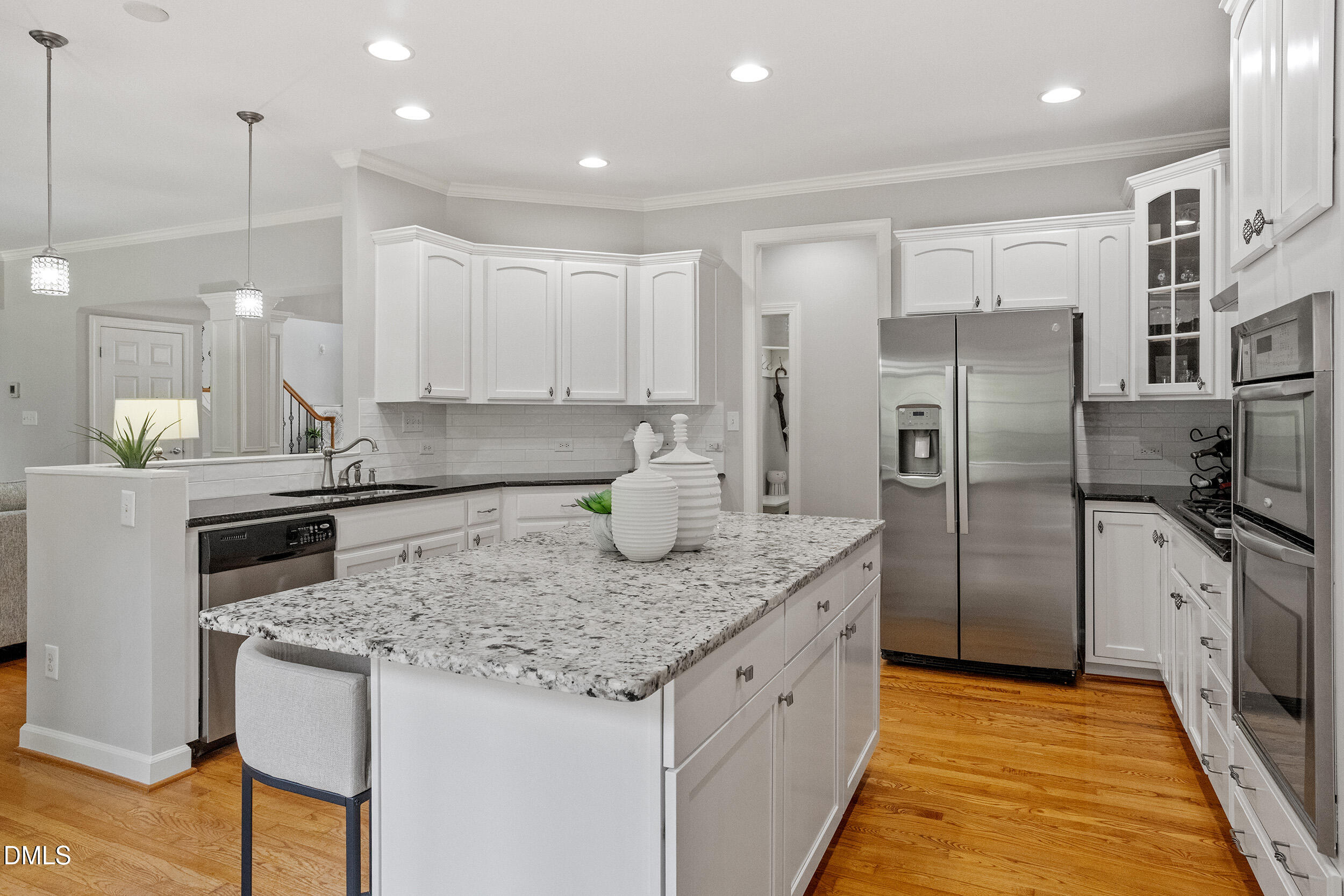 1019 Bianco Drive Raleigh, NC 27607 - Photo 12 of 29 a kitchen with stainless steel appliances granite countertop a refrigerator a sink and a stove