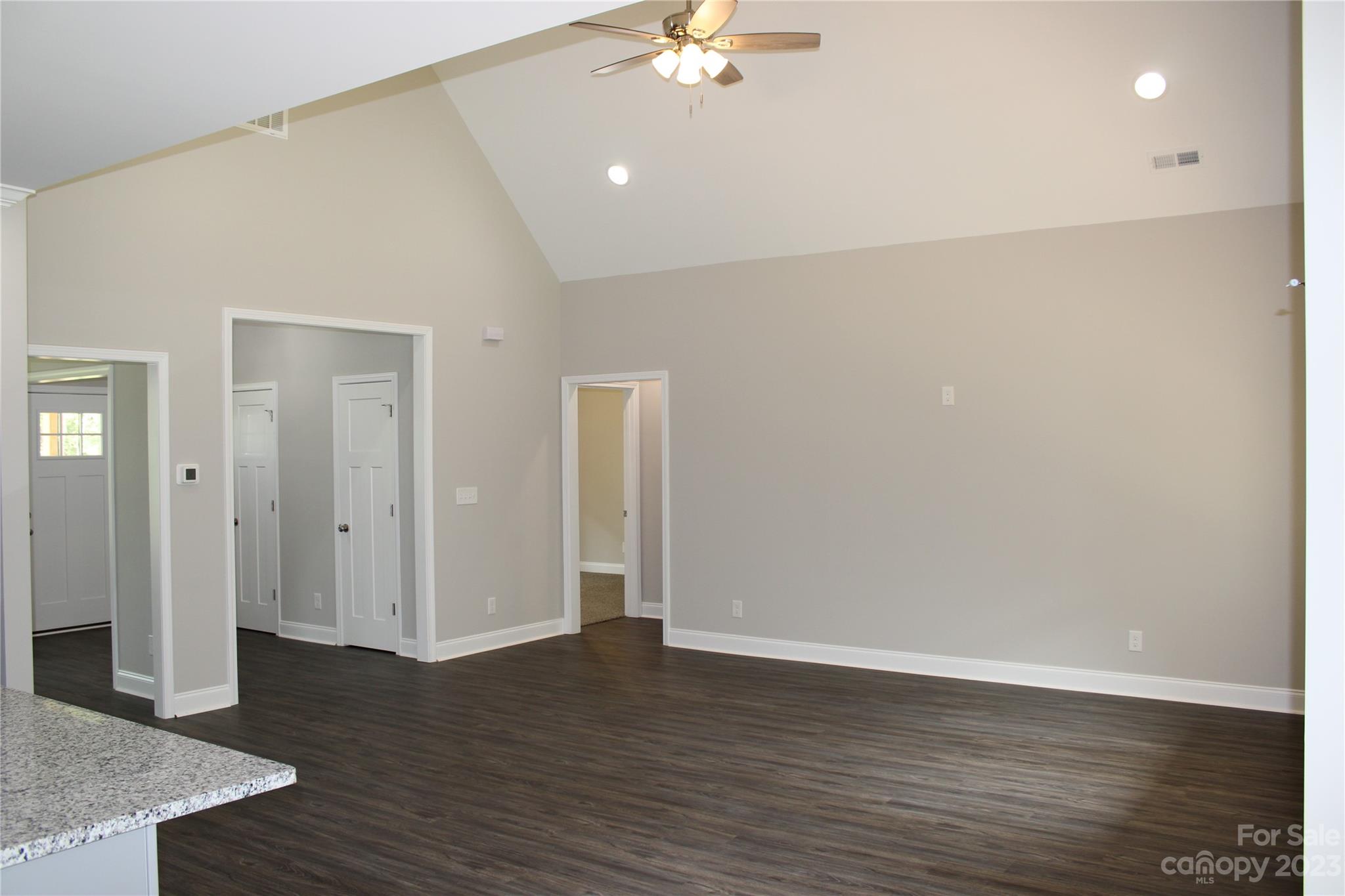2323 State Rd S-46-172 Clover, SC 29710 - Photo 6 of 17 a view of a livingroom with wooden floor and a ceiling fan