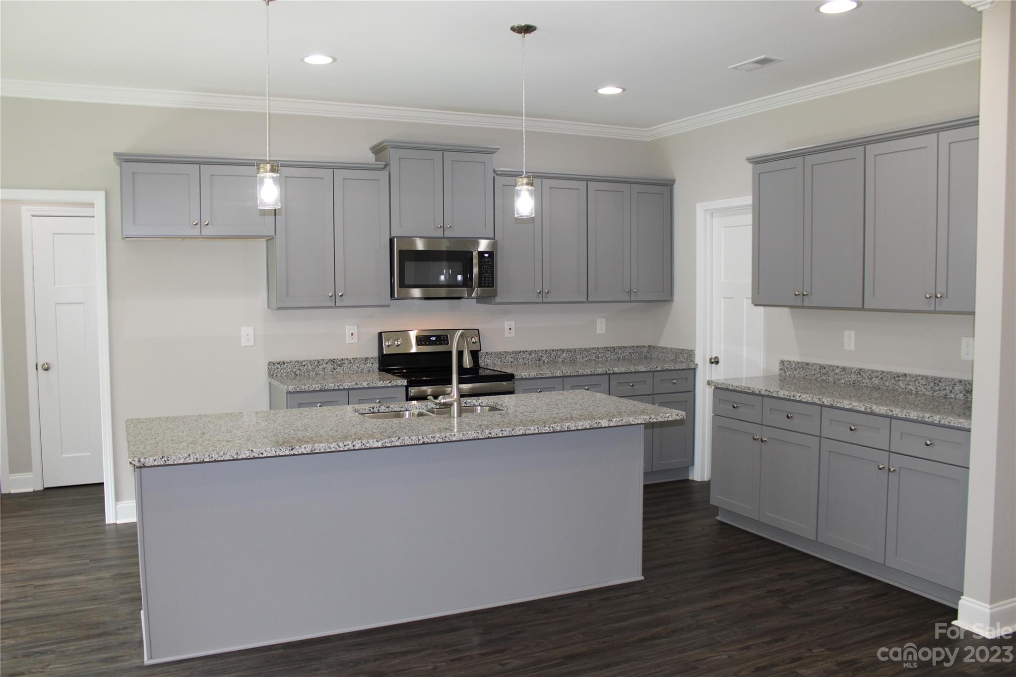 2323 State Rd S-46-172 Clover, SC 29710 - Photo 8 of 17 a kitchen with stainless steel appliances granite countertop a sink a stove and a refrigerator