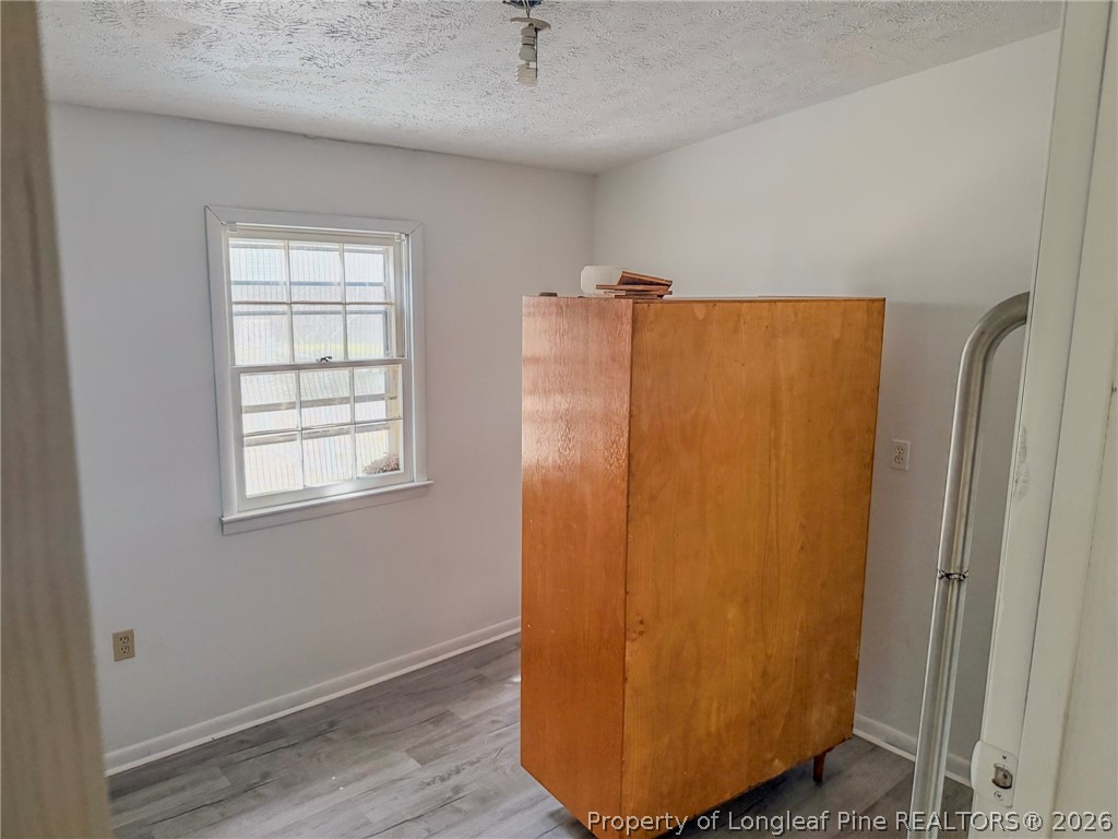 575 Veterans Road St. Pauls, NC 28384 - Photo 18 of 27 a view of a refrigerator in kitchen and windows