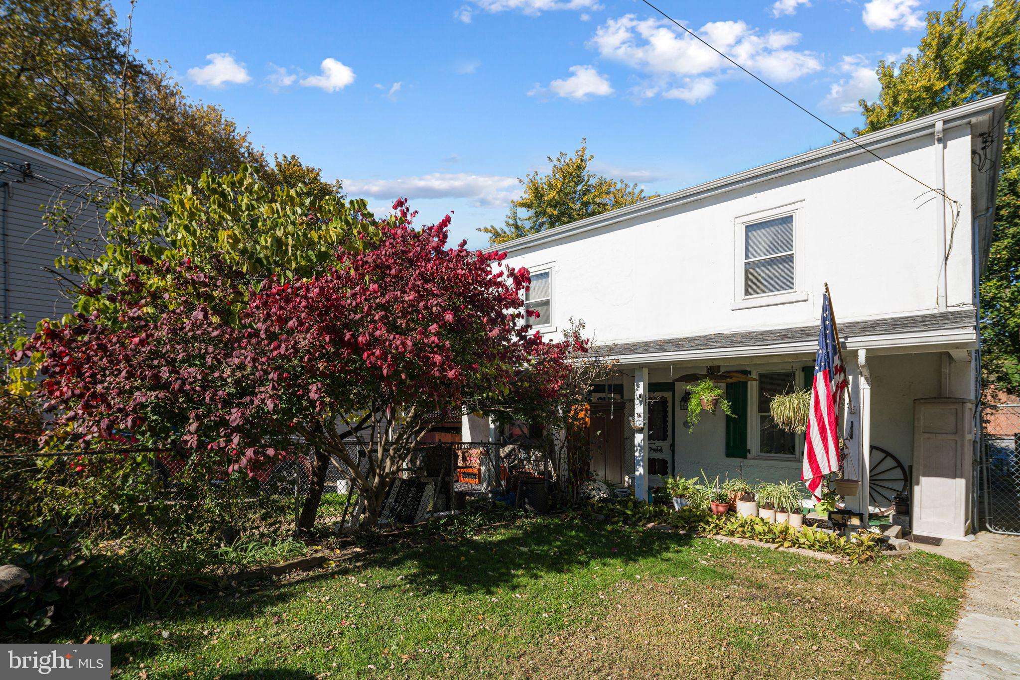 354 Ripka Street Philadelphia, PA 19128 - Photo 2 of 23 a view of a house with potted plants and a tree