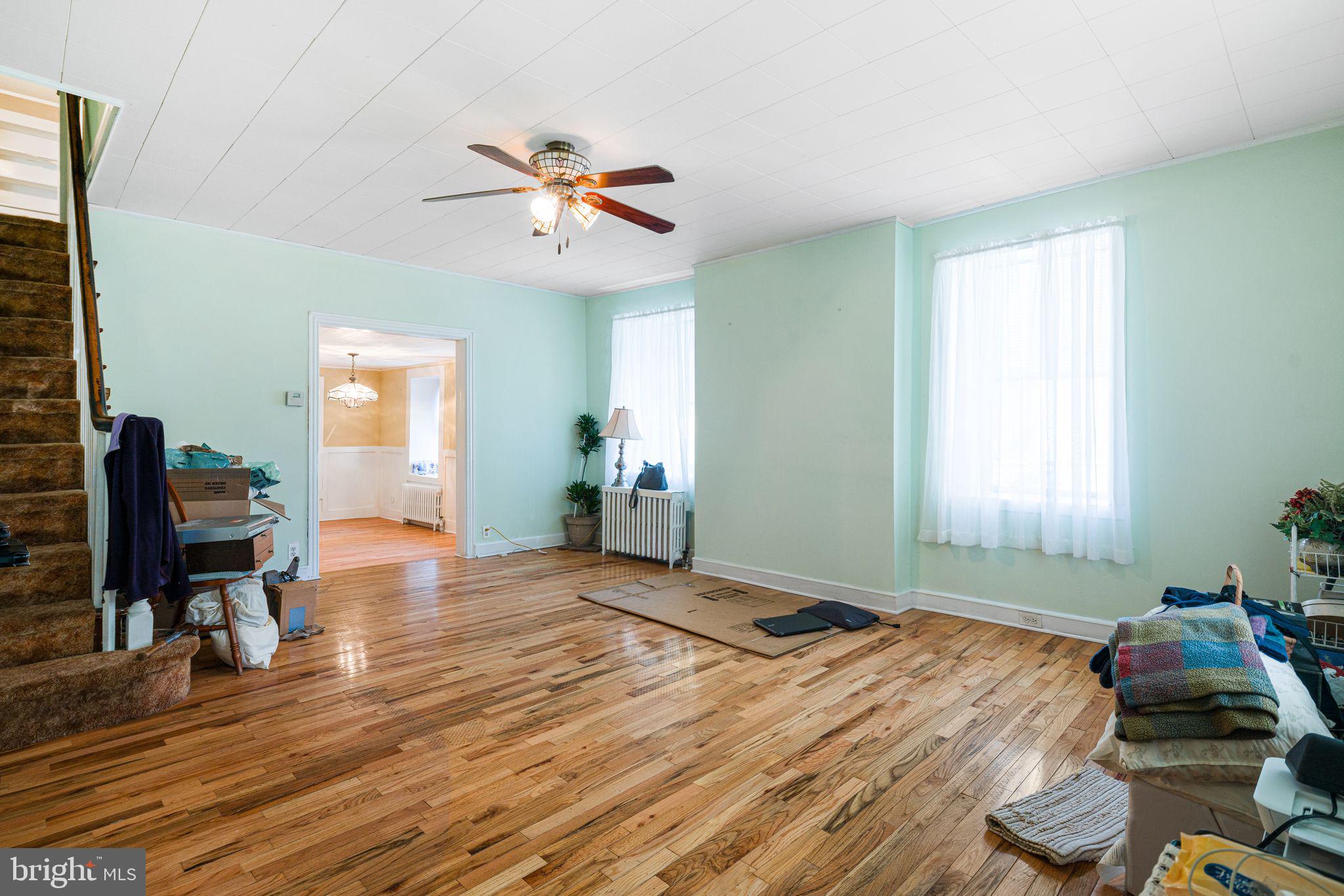 354 Ripka Street Philadelphia, PA 19128 - Photo 4 of 23 a bedroom with a bed and wooden floor