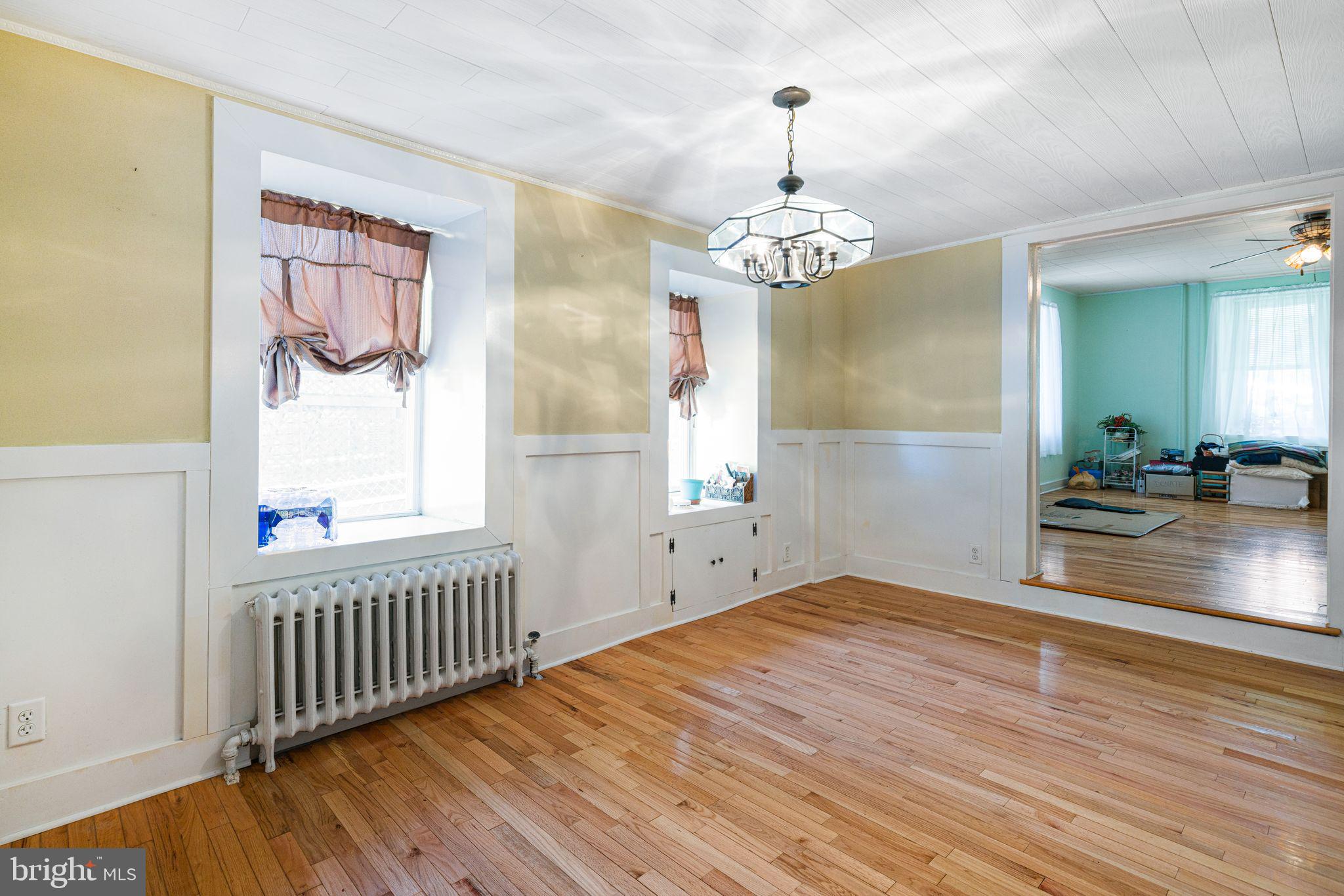 354 Ripka Street Philadelphia, PA 19128 - Photo 6 of 23 a view of a livingroom with wooden floor and windows