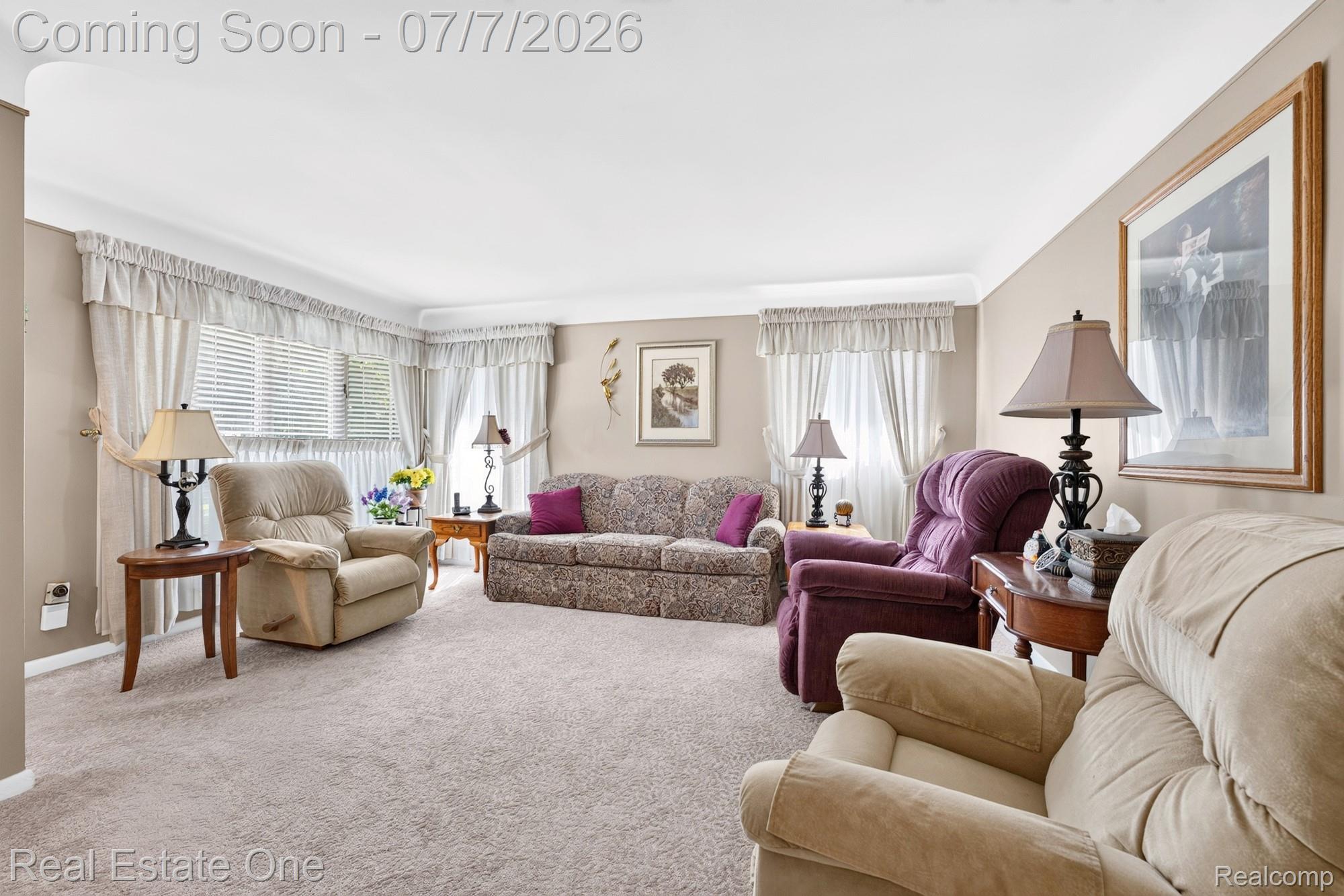 24749 Munson Street Taylor, MI 48180 - Photo 4 of 28 Spacious living area featuring neutral-toned carpeting and light beige wall paint
