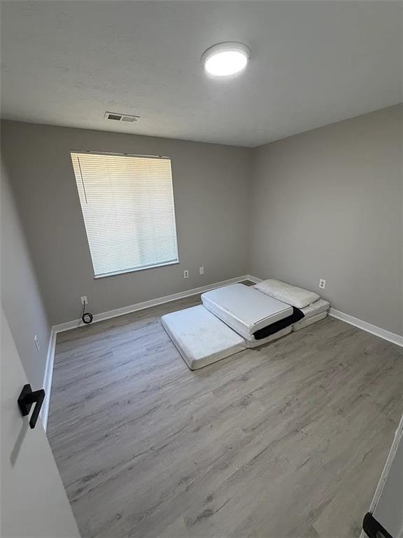 418 Engle Drive Tucker, GA 30084 - Photo 13 of 14 an empty room with wooden floor