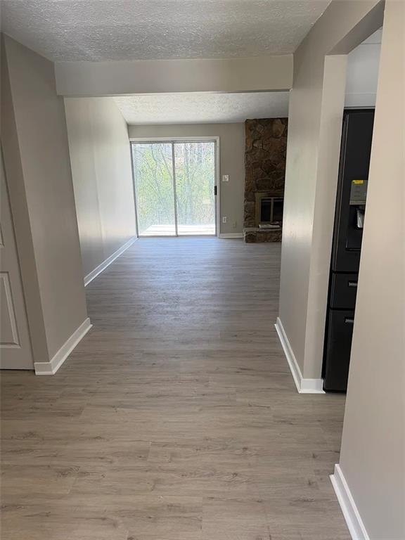 418 Engle Drive Tucker, GA 30084 - Photo 4 of 14 an empty room with wooden floor and windows