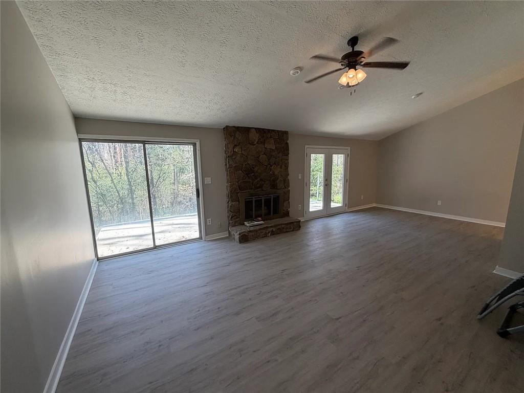 418 Engle Drive Tucker, GA 30084 - Photo 6 of 14 an empty room with wooden floor and windows