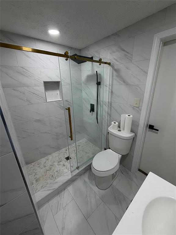 418 Engle Drive Tucker, GA 30084 - Photo 8 of 14 a bathroom with a toilet and a shower