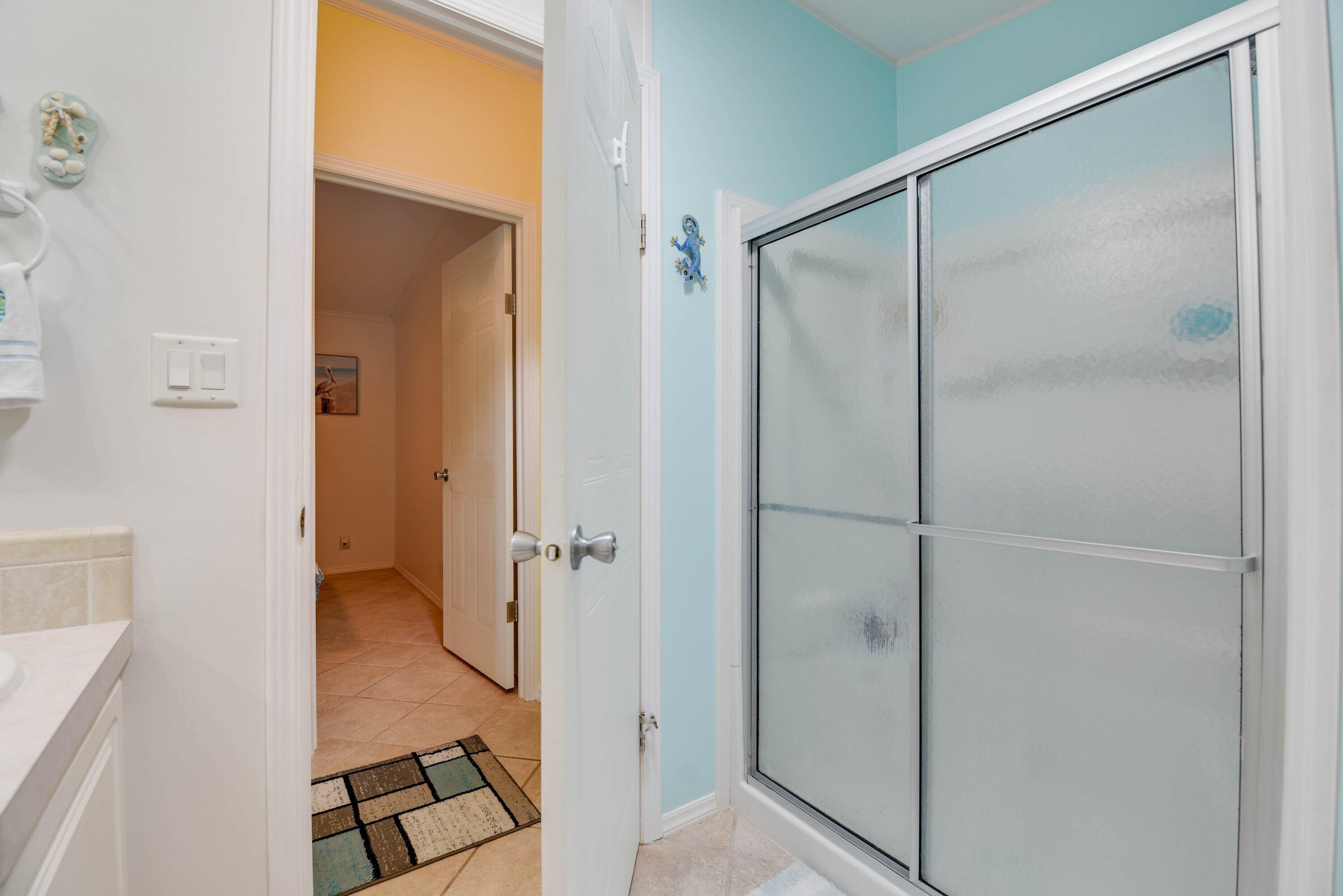 701 Spanish Main Drive, Unit 635 Cudjoe, FL 33042 - Photo 14 of 52 a bathroom with a shower and a glass door