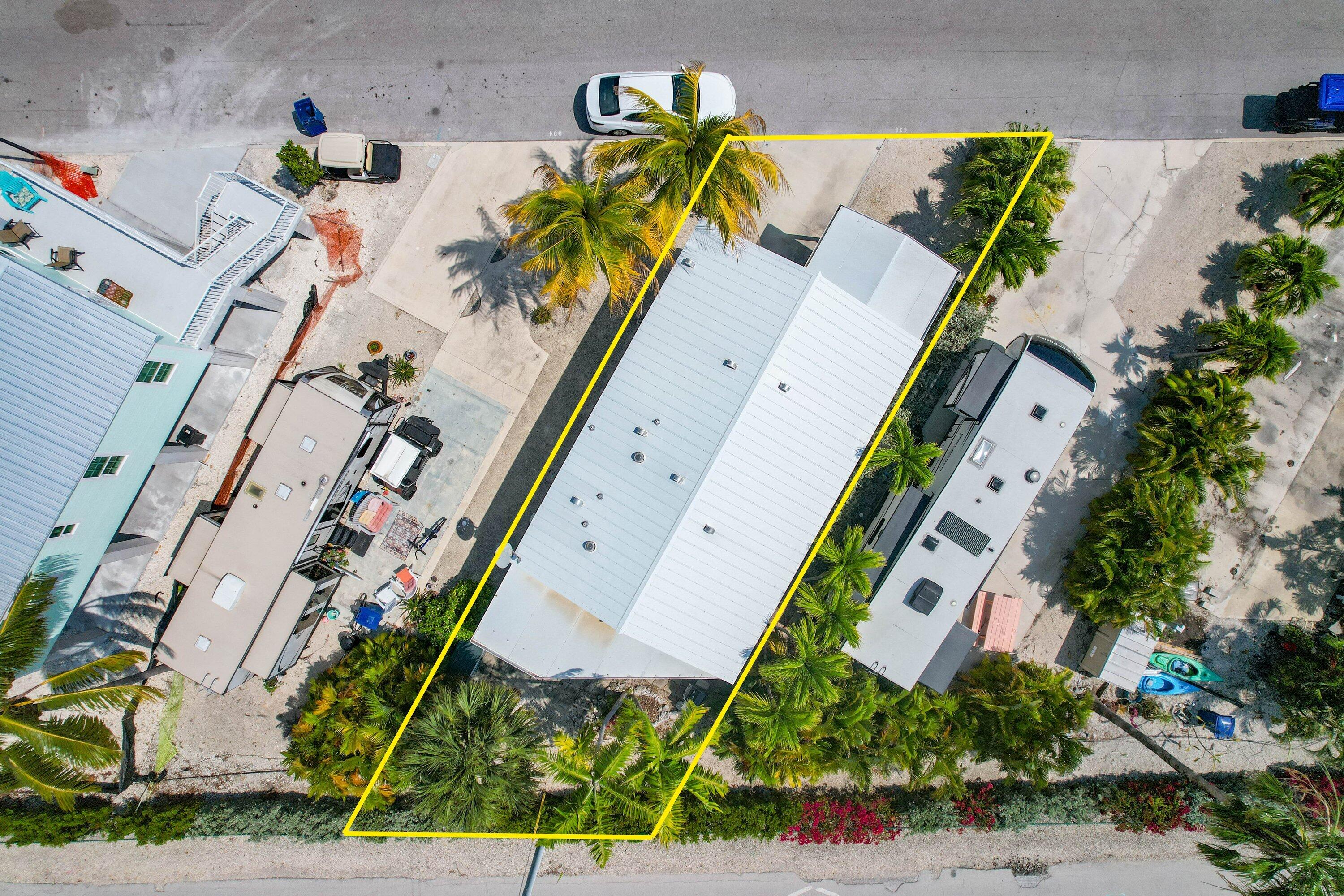 701 Spanish Main Drive, Unit 635 Cudjoe, FL 33042 - Photo 24 of 52 an aerial view of a house with a yard and greenery