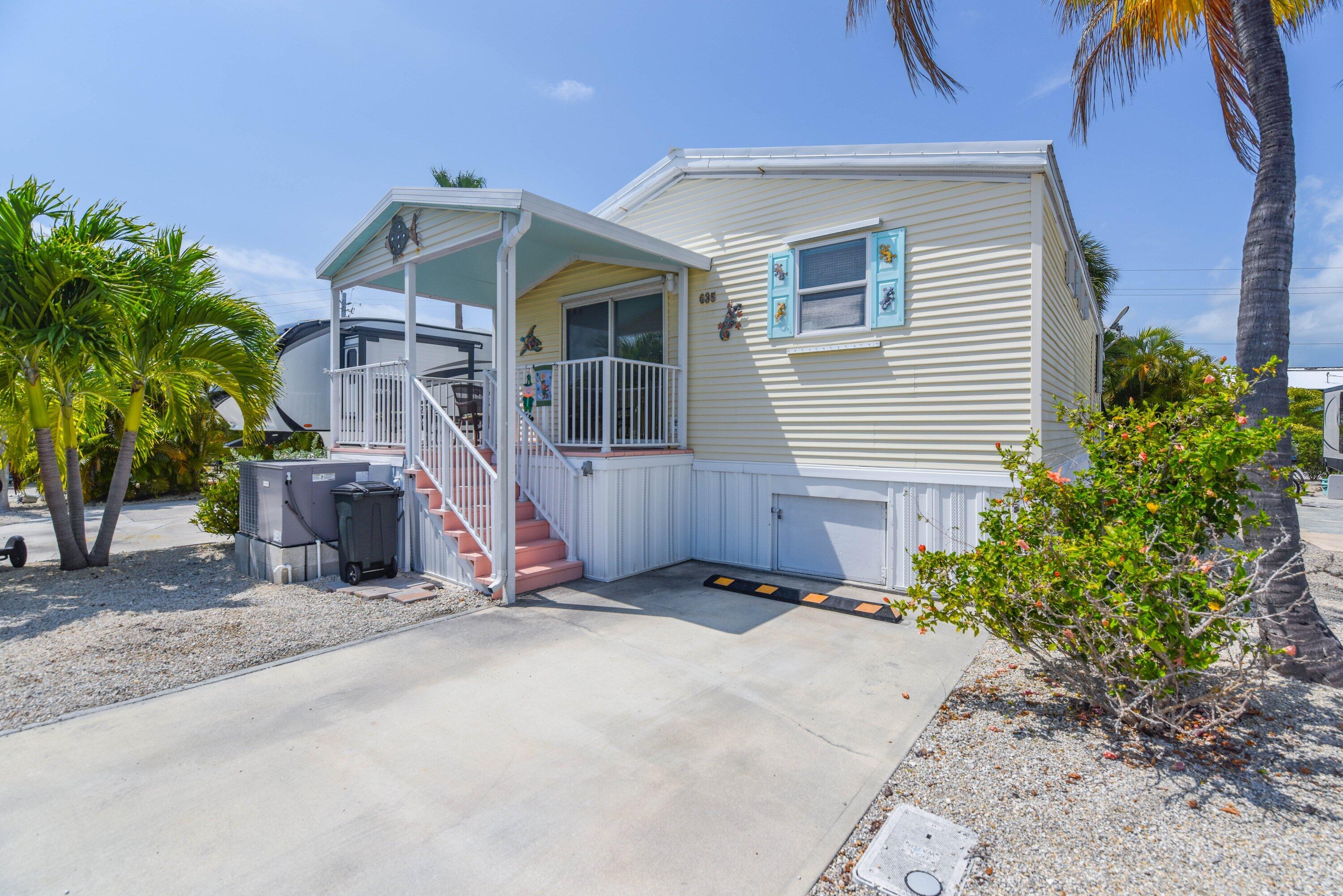 701 Spanish Main Drive, Unit 635 Cudjoe, FL 33042 - Photo 38 of 52 a view of a house with backyard and plants