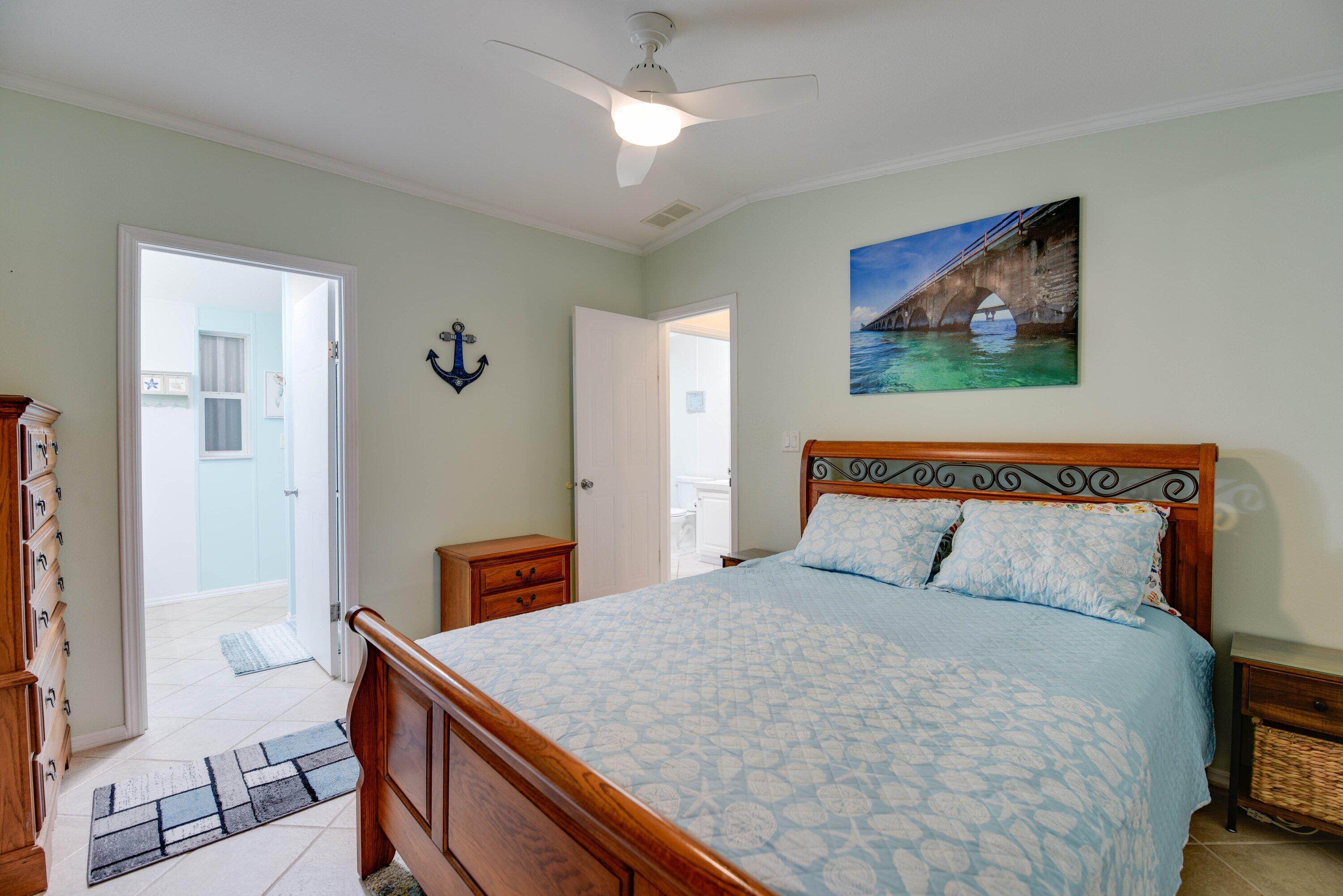 701 Spanish Main Drive, Unit 635 Cudjoe, FL 33042 - Photo 9 of 52 a bedroom with a bed and a desk