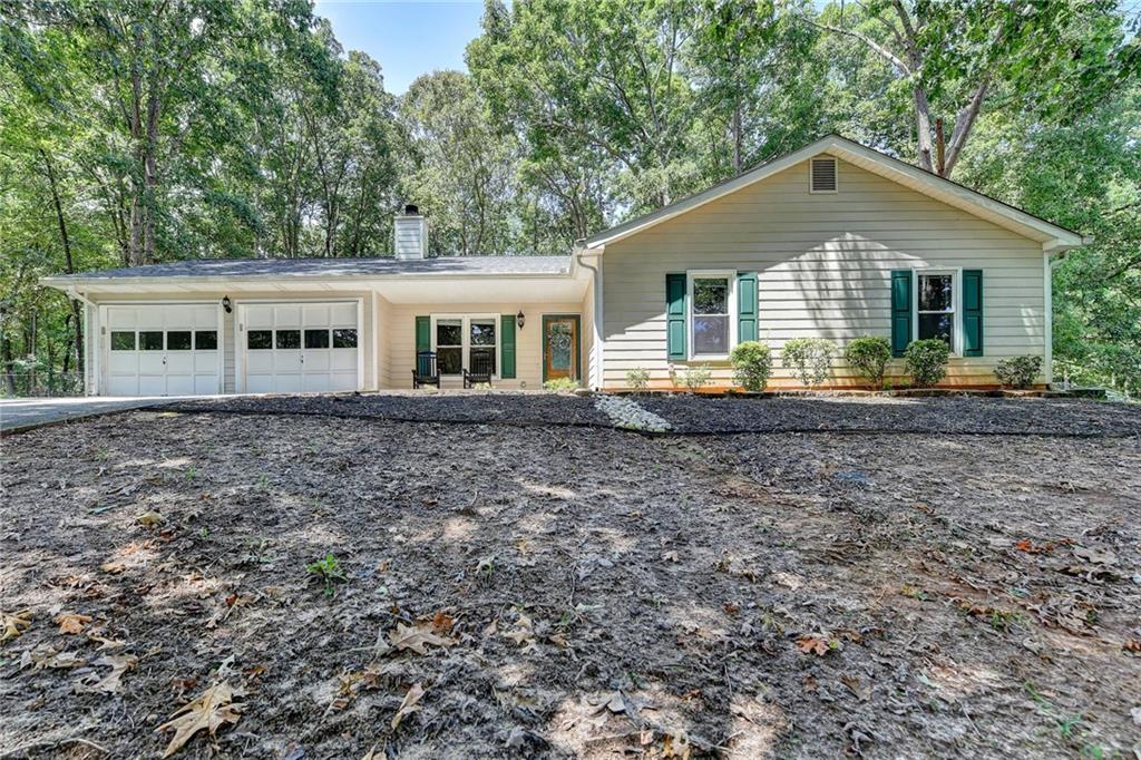 94 Hebron Church Road Dacula, GA 30019 - Photo 1 of 1 a front view of a house with a yard