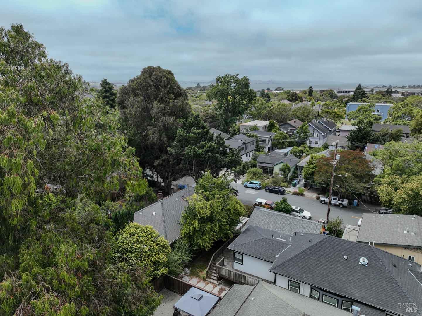 1050 Allston Way Berkeley, CA 94710 - Photo 14 of 20 an aerial view of a house with a yard and mountain view in back