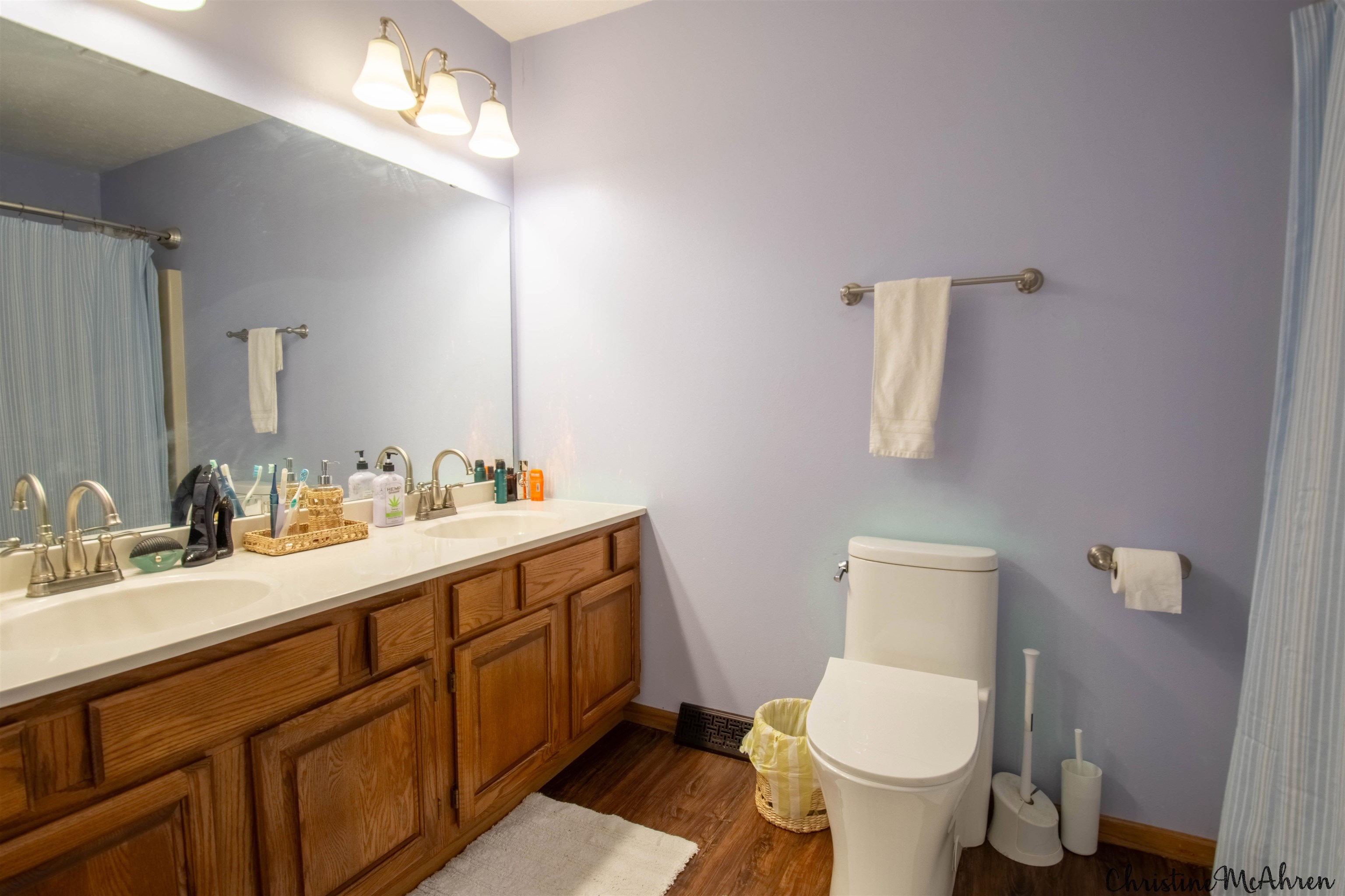 6410 Grassridge Road Rockford, IL 61108 - Photo 19 of 31 a bathroom with a toilet sink and mirror