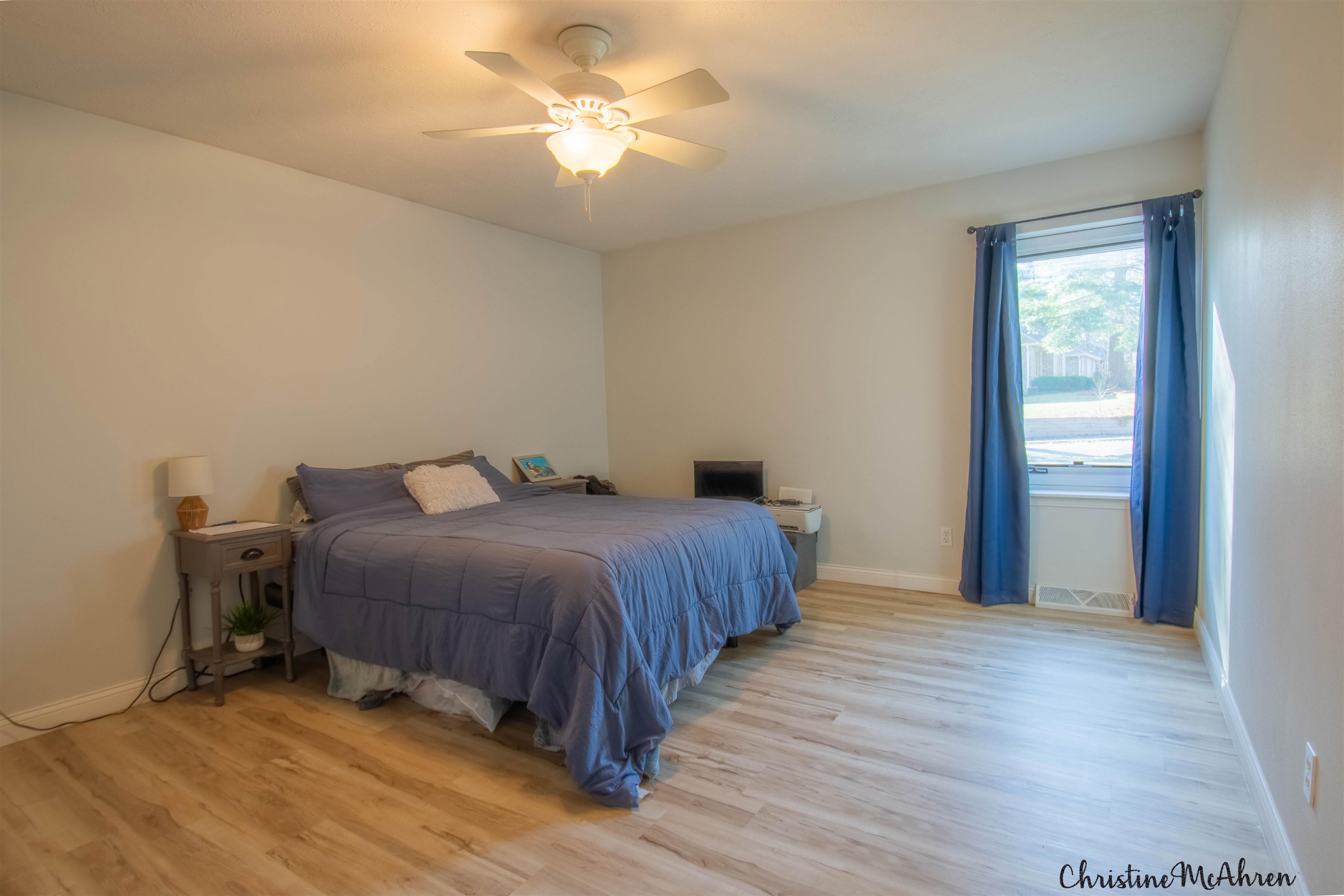 6410 Grassridge Road Rockford, IL 61108 - Photo 22 of 31 a bedroom with a bed and a chandelier