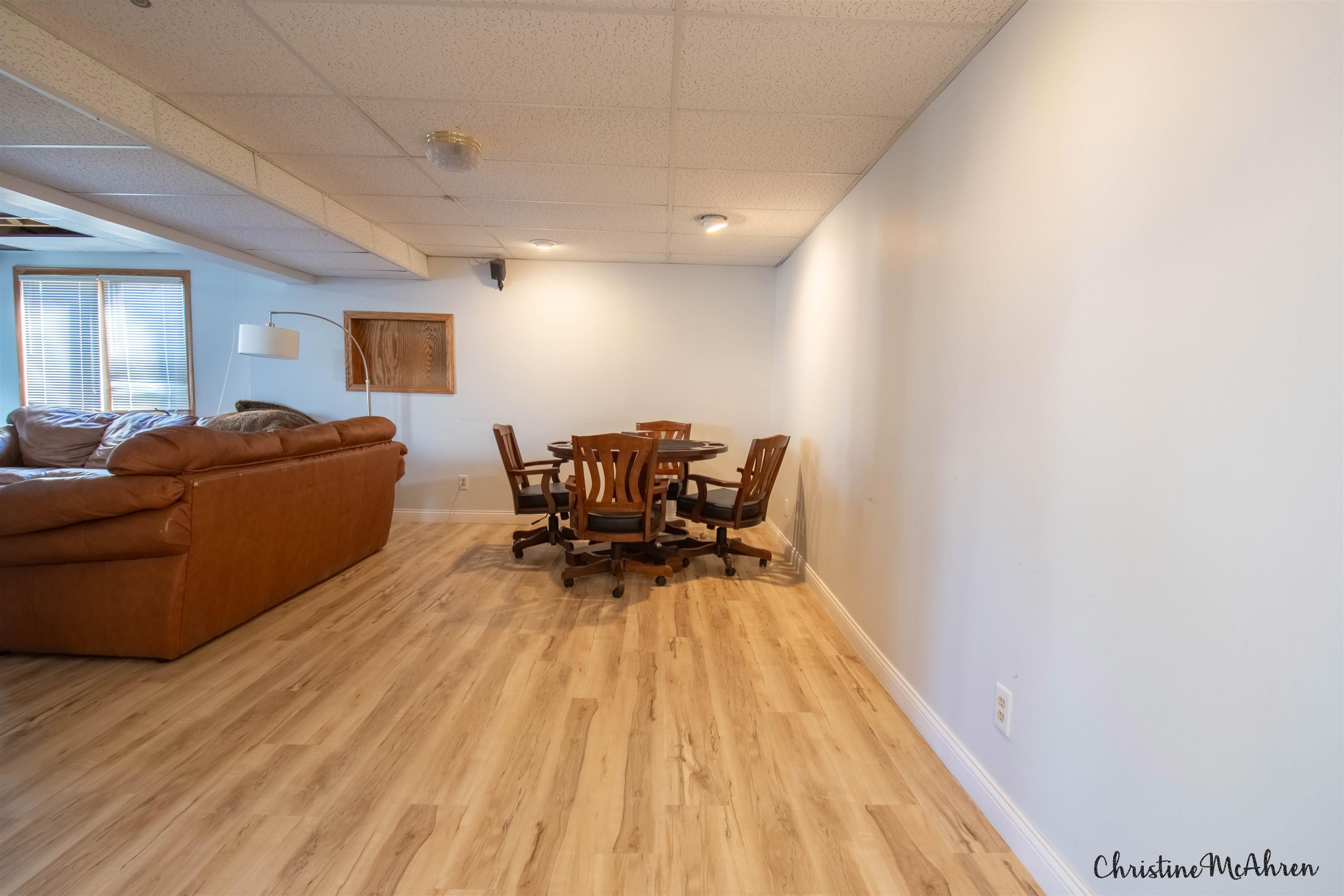 6410 Grassridge Road Rockford, IL 61108 - Photo 23 of 31 a living room with furniture and a wooden floor