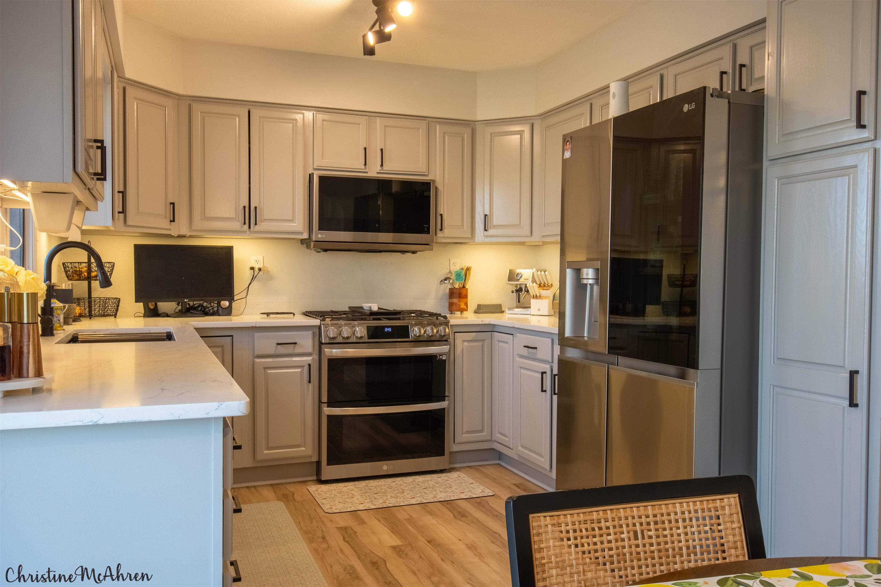6410 Grassridge Road Rockford, IL 61108 - Photo 10 of 31 a kitchen with stainless steel appliances a refrigerator stove and sink