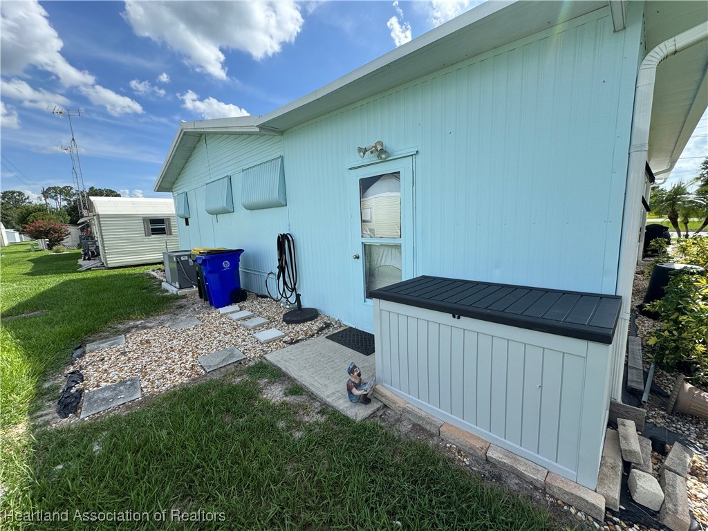 2940 Louis Street Sebring, FL 33872 - Photo 36 of 47 a bedroom with a bed and a tv
