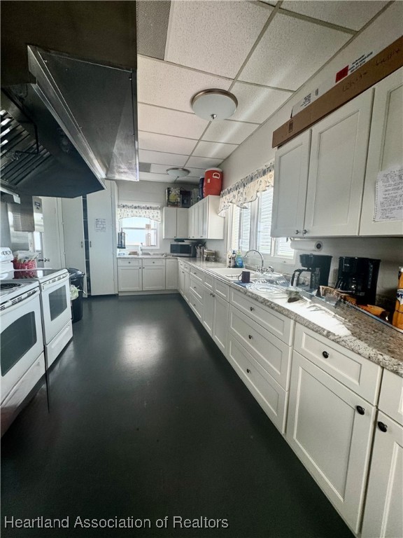 2940 Louis Street Sebring, FL 33872 - Photo 42 of 47 a kitchen that has a lot of cabinets in it and appliances