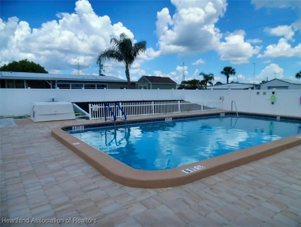 2940 Louis Street Sebring, FL 33872 - Photo 43 of 47 a view of a swimming pool with a terrace