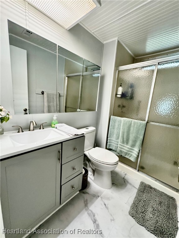 2940 Louis Street Sebring, FL 33872 - Photo 9 of 47 a bathroom with a double vanity sink toilet and shower