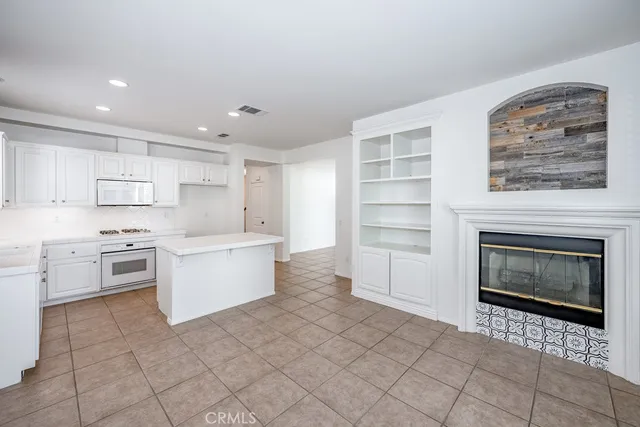 a kitchen with a cabinets and white stove