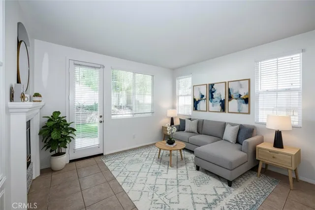 a living room with furniture and flowers