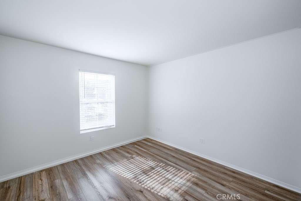 23321 Beachcomber Lane Valencia, CA 91355 - Photo 32 of 40 Large upstairs bedroom or suite space with wood flooring and ample light — prime for family comfort.