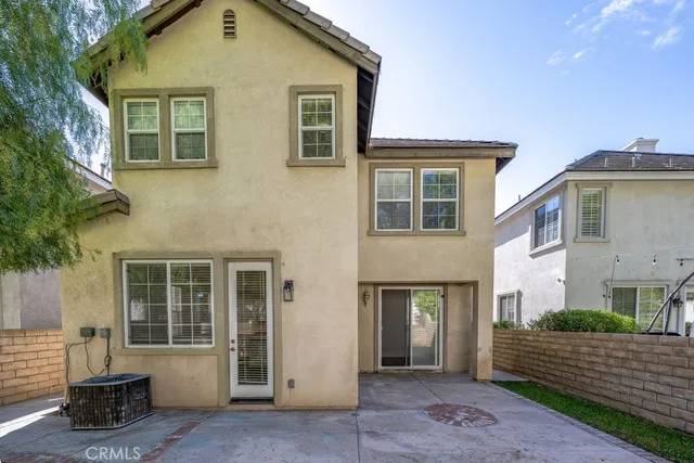 a view of a backyard with table and chairs