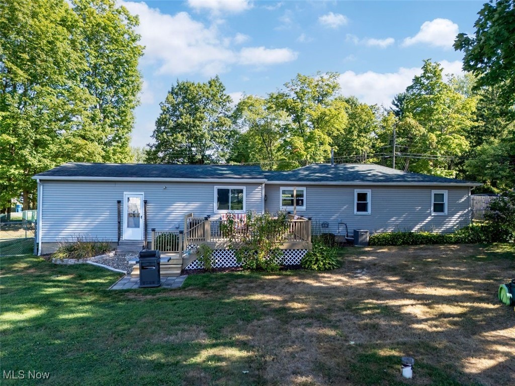 4184 Johnson Road Barberton, OH 44203 - Photo 18 of 25 Back of house featuring a wooden deck, a patio, and a yard