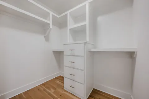 a view of an empty walk in closet