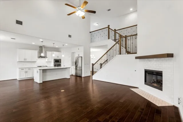 a view of kitchen with microwave and wooden floor