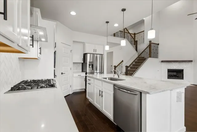 a kitchen that has a lot of cabinets in it