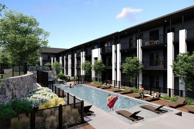 a building outdoor space with patio furniture and potted plants