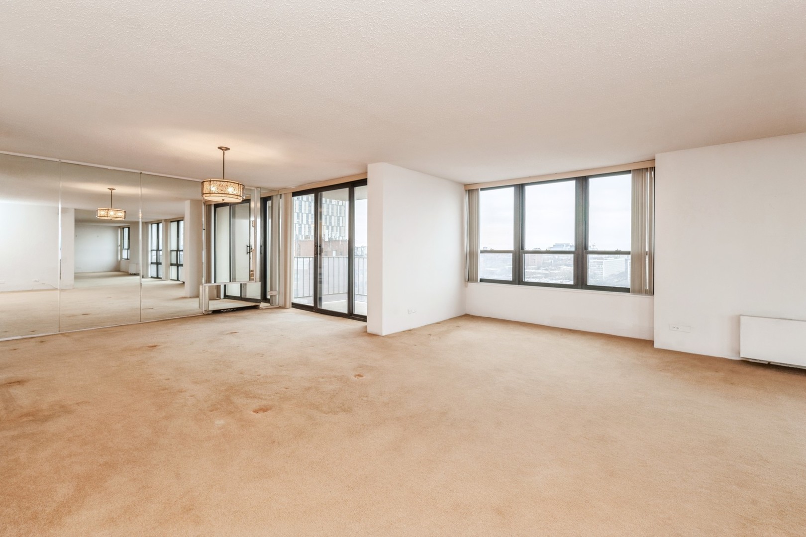 5471 South Hyde Park Boulevard, Unit 16AB Chicago, IL 60615 - Photo 7 of 18 a view of an empty room with a window