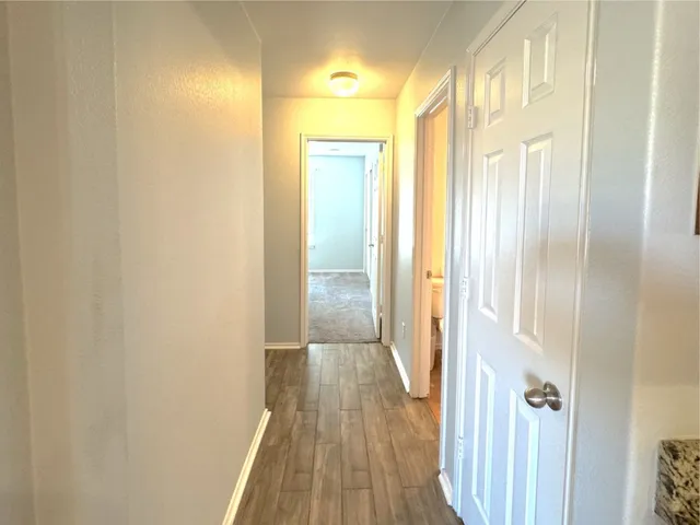 a view of a bathroom from a hallway