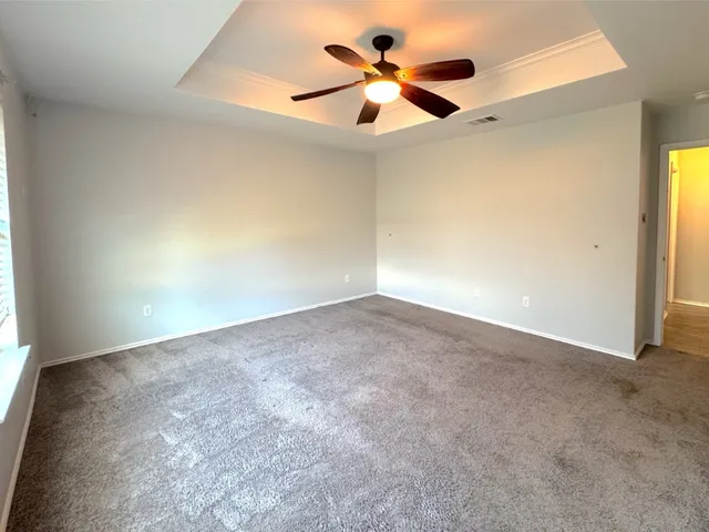 a view of a big room with carpet