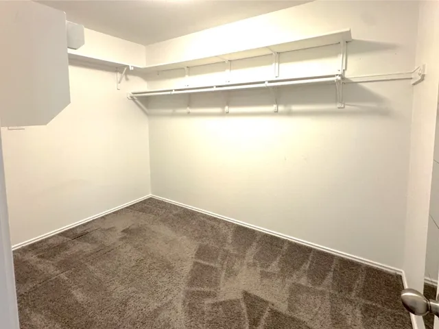 a view of a room with racks on the wall