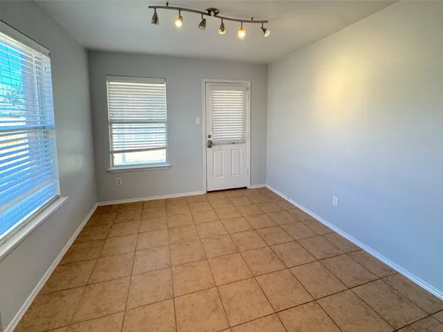 a view of an empty room and window