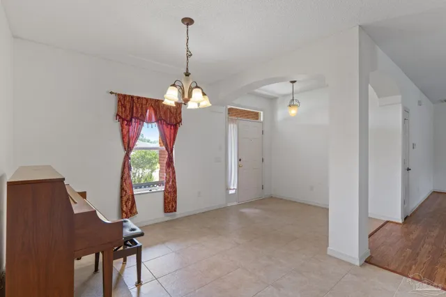 a kitchen with a refrigerator and a stove