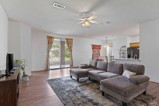 a view of a livingroom with furniture and entryway