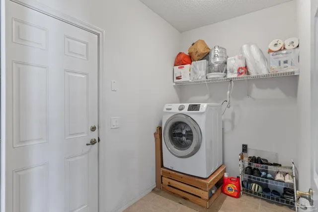 a spacious bedroom with a bed and a window