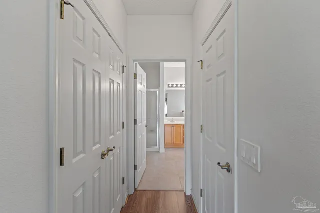 a view of walk in closet with clothes