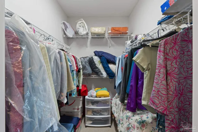 a view of kitchen with sink cabinet and windows