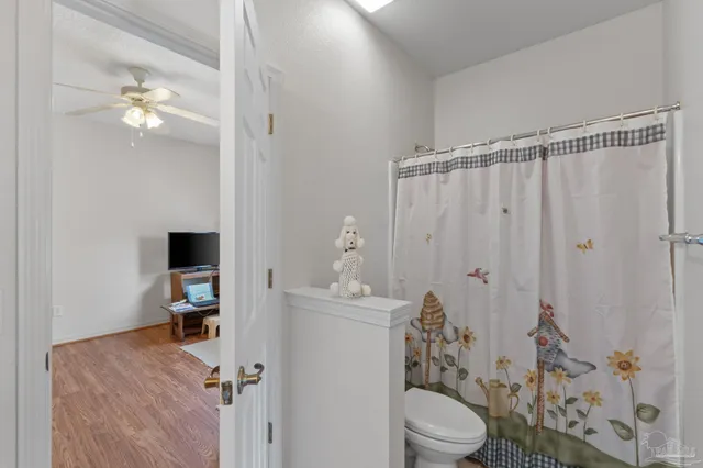 a view of hallway with wooden floor