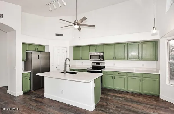 a kitchen with a refrigerator a sink and dishwasher