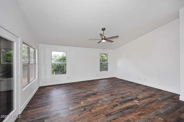 a view of a kitchen with a sink and a floor to ceiling window