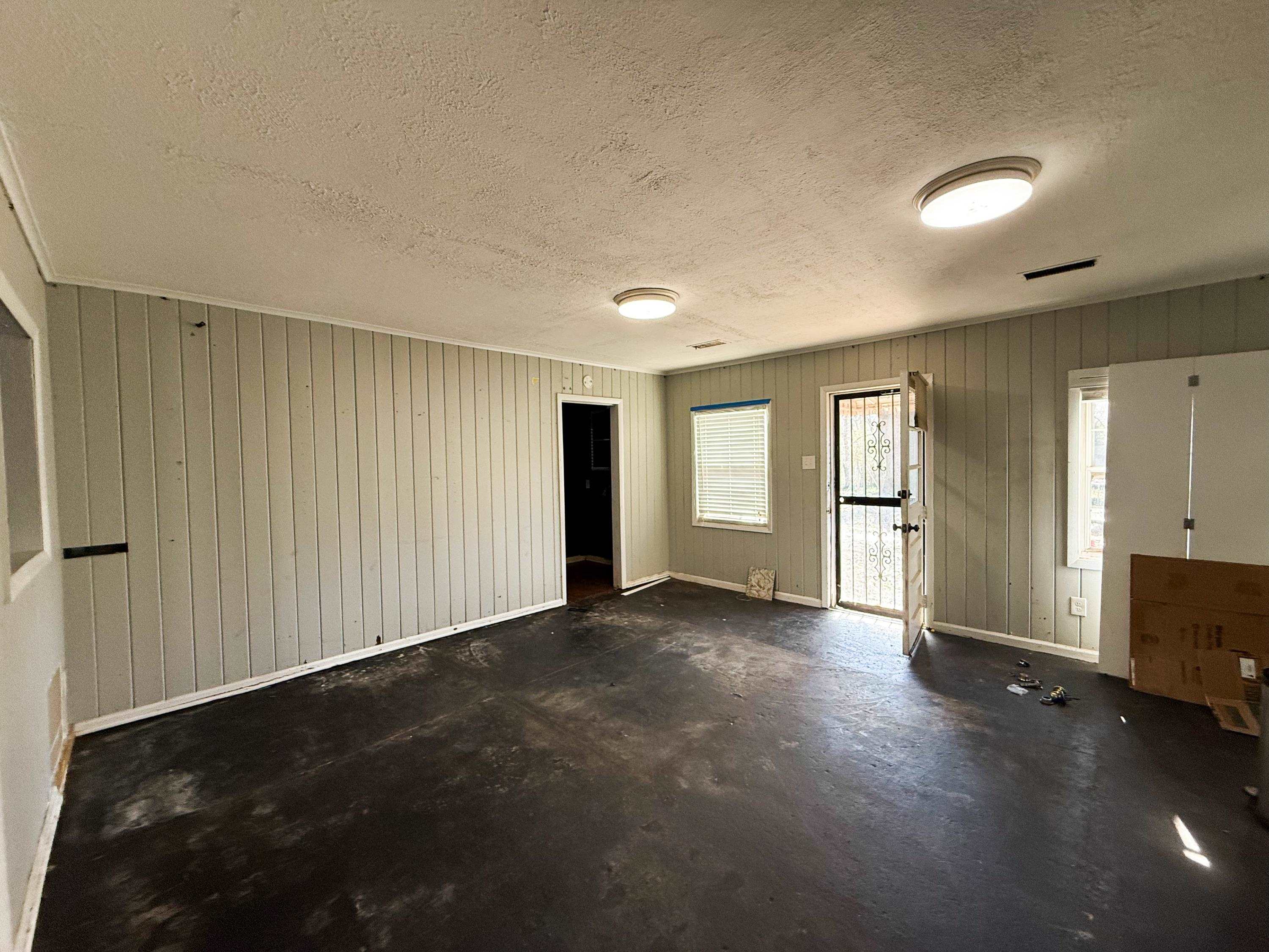 1027 Waring Road Memphis, TN 38122 - Photo 7 of 14 Foyer with a textured ceiling and concrete floors